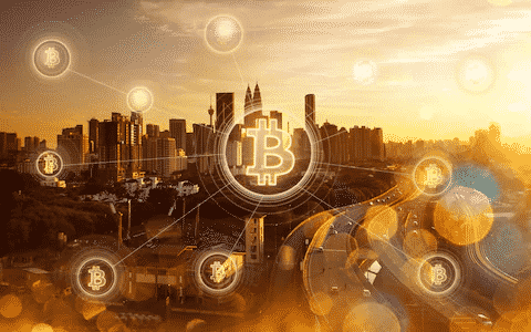 Many icons of bitcoins logo and the city on the background