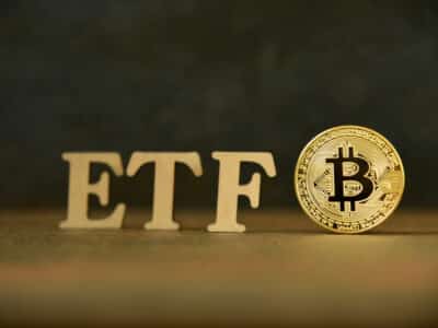 Bitcoin coin with ETF text on stone background, Concept Entering the Digital Money Fund. ETF and Bitcoin concept