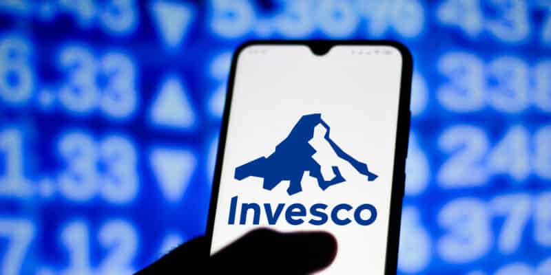 In this photo illustration the Invesco logo seen displayed on a smartphone