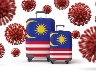 Malaysia flag travel suitcases with coronavirus. 3D Rendering