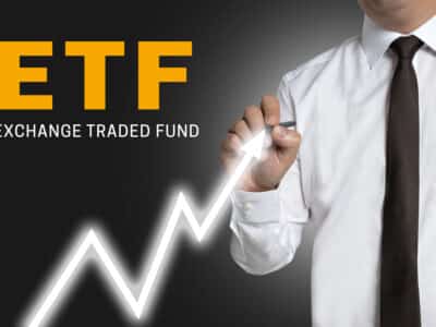 etf trader draws market price on touchscreen.