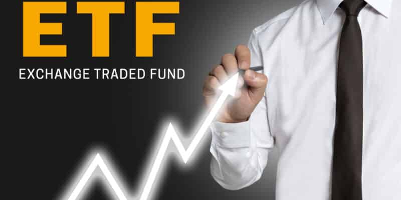 etf trader draws market price on touchscreen.