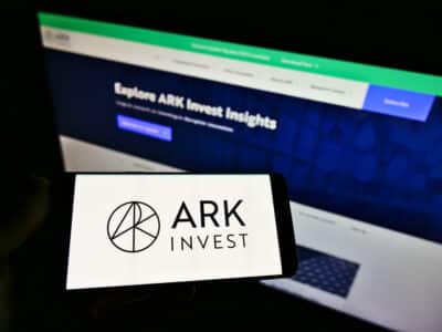 Focus on phone display, with logo of US asset manager ARK Investment