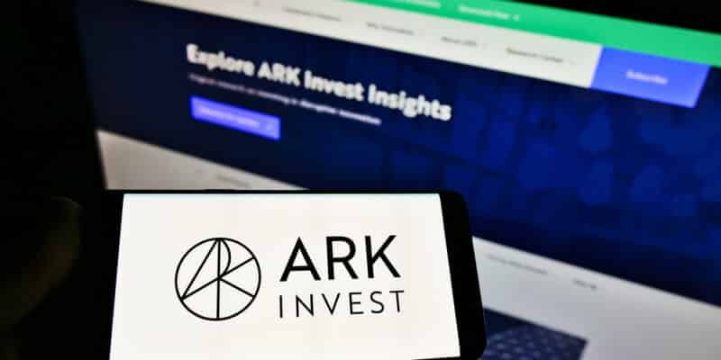 Focus on phone display, with logo of US asset manager ARK Investment