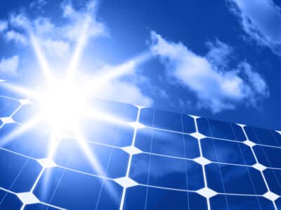 solar panels - clean energy source on the background of sky and bright sun
