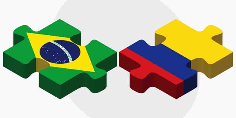 Brazil and Colombia Flags in puzzle isolated on white background