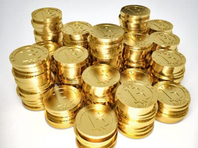 3d image of golden bitcoin on white